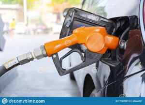 fuel-nozzle-filled-car-being-gasoline-gas-station-pumping-black-pump-171683514-1068x771