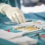 cropped-image-female-surgeon-reaching-1054994715